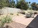 Backyard with patio, gravel bed, and an outdoor seating area with a metal table at 2366 Brockton Way, Henderson, NV 89074