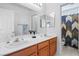 Bright bathroom features dual sinks, large mirror and separate shower/tub area at 2366 Brockton Way, Henderson, NV 89074