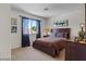 Comfortable bedroom featuring a wooden bed frame and side table with stylish lamps at 2366 Brockton Way, Henderson, NV 89074