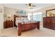 Warm primary bedroom with wood furniture, decorative accents, and plenty of natural light at 2366 Brockton Way, Henderson, NV 89074