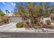 Charming home featuring mature landscaping, tile roof, and attached two-car garage at 2366 Brockton Way, Henderson, NV 89074