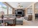 Open-concept living room featuring a large entertainment center and natural light at 2366 Brockton Way, Henderson, NV 89074