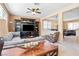 Bright living area showcasing a built-in media center, comfortable seating, and an open layout to the dining area at 2366 Brockton Way, Henderson, NV 89074
