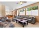 Spacious living room with an open layout, large windows, and plenty of seating options at 2366 Brockton Way, Henderson, NV 89074