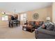 Inviting living room featuring neutral walls, plush seating, and an adjacent dining area perfect for entertaining at 2366 Brockton Way, Henderson, NV 89074