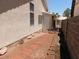 Exterior of home showing pathway in backyard with desert landscaping and block wall at 241 Honeywood St, Henderson, NV 89074