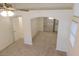Cozy bedroom featuring plush carpeting and an arched entrance into a walk-in closet at 241 Honeywood St, Henderson, NV 89074