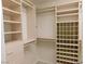 Well-organized walk-in closet with custom shelving and hanging rods for optimal storage at 241 Honeywood St, Henderson, NV 89074