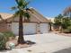 Attractive single-story home with a two-car garage, desert landscaping, and a concrete driveway at 241 Honeywood St, Henderson, NV 89074