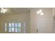 Bright foyer with natural light, a ceiling fan, and views of the home's entry door at 241 Honeywood St, Henderson, NV 89074