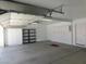 Spacious garage features storage cabinets and shelving for tools and other home necessities at 241 Honeywood St, Henderson, NV 89074