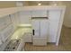 Modern kitchen equipped with white appliances, sleek countertops, and ample cabinet space at 241 Honeywood St, Henderson, NV 89074