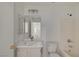 Bathroom featuring single sink vanity, mirror, bathtub with shower head, and toilet at 2431 Lilac Cove St, Las Vegas, NV 89135