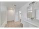 Bathroom featuring a vanity with modern fixtures, tiled floors, and access to a shower-over-tub and closet at 2431 Lilac Cove St, Las Vegas, NV 89135