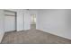 An empty bedroom features closet and carpet floors with white walls and doors at 2431 Lilac Cove St, Las Vegas, NV 89135