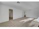 Spacious bedroom with neutral carpet, light-colored walls, and natural light filtering in at 2431 Lilac Cove St, Las Vegas, NV 89135