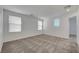An empty bedroom featuring carpet floors, white walls, natural light, and window blinds at 2431 Lilac Cove St, Las Vegas, NV 89135