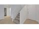 Light-filled entryway features access to stairs, living area and a door to the bathroom at 2431 Lilac Cove St, Las Vegas, NV 89135
