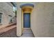 Classic front entrance with covered walkway and desert-friendly landscaping at 2431 Lilac Cove St, Las Vegas, NV 89135