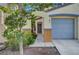 Welcoming front entrance with landscaped walkway and attached two-car garage at 2431 Lilac Cove St, Las Vegas, NV 89135