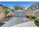 Charming two-story home with a two car garage and well-maintained landscaping at 2431 Lilac Cove St, Las Vegas, NV 89135
