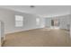 Expansive living room featuring neutral walls, smooth flooring, and modern lighting at 2431 Lilac Cove St, Las Vegas, NV 89135