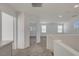 A bright and spacious loft area with plush carpet and access to bedrooms and hallways at 2431 Lilac Cove St, Las Vegas, NV 89135