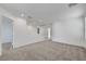 A spacious loft area with neutral carpeting, white walls, and ample natural light at 2431 Lilac Cove St, Las Vegas, NV 89135