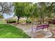 Picturesque park with lush greenery, mature trees, a gazebo, and benches for relaxation and community gathering at 2431 Lilac Cove St, Las Vegas, NV 89135