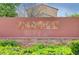 Pinedale Community Sign in front of a block wall and lush green landscaping at 2431 Lilac Cove St, Las Vegas, NV 89135