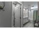 Clean and modern bathroom with double sinks, a soaking tub, and contemporary finishes at 2530 Catallo St, Henderson, NV 89044