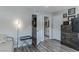 Bright bedroom featuring wood-look floors, an open ensuite bathroom and natural light at 2530 Catallo St, Henderson, NV 89044