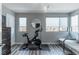 Bright exercise room with a stationary bike, a window, and a comfortable bench at 2530 Catallo St, Henderson, NV 89044