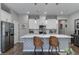 Beautiful kitchen with a large island, modern appliances, pendant lighting, and stylish decor at 2530 Catallo St, Henderson, NV 89044