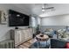 Inviting living room with modern furnishings, and big screen TV at 2530 Catallo St, Henderson, NV 89044