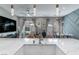 Open-concept living space featuring a kitchen island, dining table, and modern furnishings at 2530 Catallo St, Henderson, NV 89044