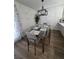 Bright dining area features modern lighting, dining table, and hardwood floors at 332 Dockside Ct, Las Vegas, NV 89145