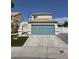 Charming two-story home featuring an attached two-car garage and a well-manicured lawn at 332 Dockside Ct, Las Vegas, NV 89145
