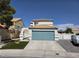 Charming two-story home featuring an attached two-car garage and a well-manicured lawn at 332 Dockside Ct, Las Vegas, NV 89145
