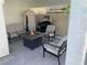 Inviting outdoor patio featuring comfortable seating, a barbecue grill, and a fire pit table at 332 Dockside Ct, Las Vegas, NV 89145