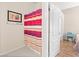 Bathroom area features a shower with striped curtain, next to door and bedside table at 3451 Desert Cliff St # 103, Las Vegas, NV 89129