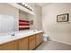 Bright bathroom with double sinks, ample vanity space, and well-lit mirror for a functional space at 3451 Desert Cliff St # 103, Las Vegas, NV 89129