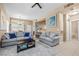Cozy living room with neutral tones, comfortable seating, and a view into the adjacent dining space at 3451 Desert Cliff St # 103, Las Vegas, NV 89129