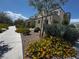 Home exterior displaying lush landscaping, complemented by a well-maintained walkway at 3493 Arcadian King Ave, Las Vegas, NV 89106