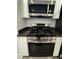 Stainless steel gas range and microwave combo, complemented by white cabinetry at 3493 Arcadian King Ave, Las Vegas, NV 89106