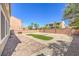 Large backyard features a paver patio and low-maintenance landscaping, perfect for outdoor entertaining at 4016 Gaster Ave, North Las Vegas, NV 89081