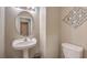 Powder room features pedestal sink and modern fixtures at 4016 Gaster Ave, North Las Vegas, NV 89081