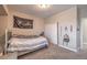 Neutral bedroom with carpet, closet and large Raiders flag at 4016 Gaster Ave, North Las Vegas, NV 89081
