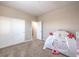 This bedroom features carpet, neutral paint, a closet, and a door to the hallway at 4016 Gaster Ave, North Las Vegas, NV 89081