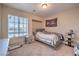 Comfortable bedroom featuring a large window that allows lots of natural light to enter the space at 4016 Gaster Ave, North Las Vegas, NV 89081